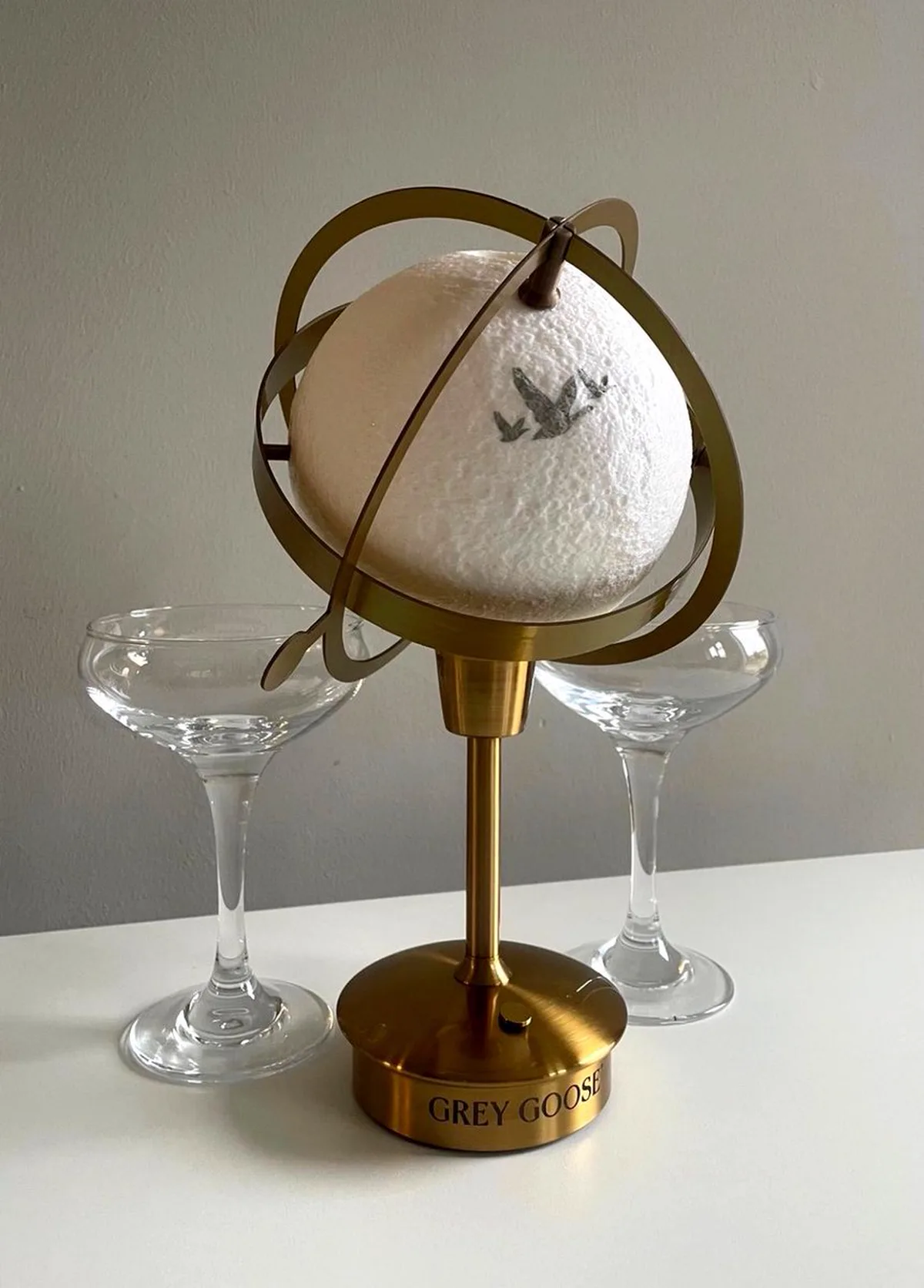 Bruff Drinks case study · Grey Goose moon-globe centrepiece on brass armillary stand