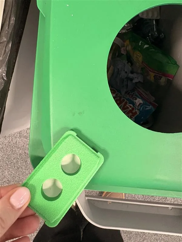 A green 3D printed mini DURABIN pen pot held beside a full size Durable DURABIN recycling bin, showing the faithful scale replica