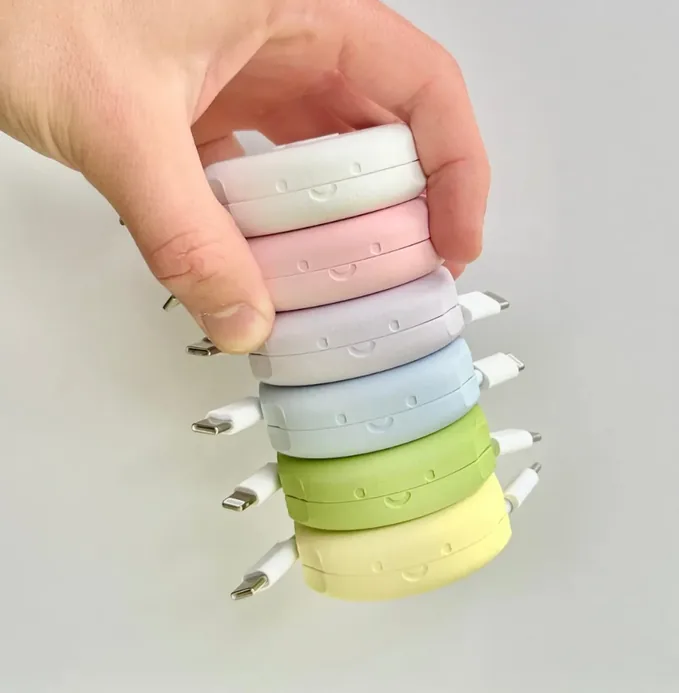 Batch of 3D-printed cable winders for Pebbl — small DTC accessory production