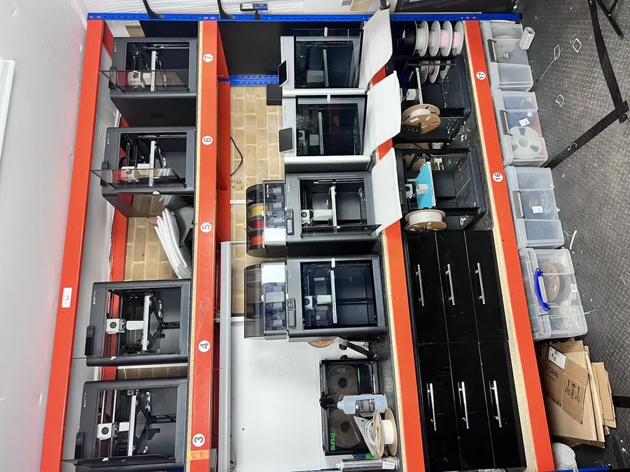 Inside the 3D Printing Express workshop — machines mid-print, Bournemouth