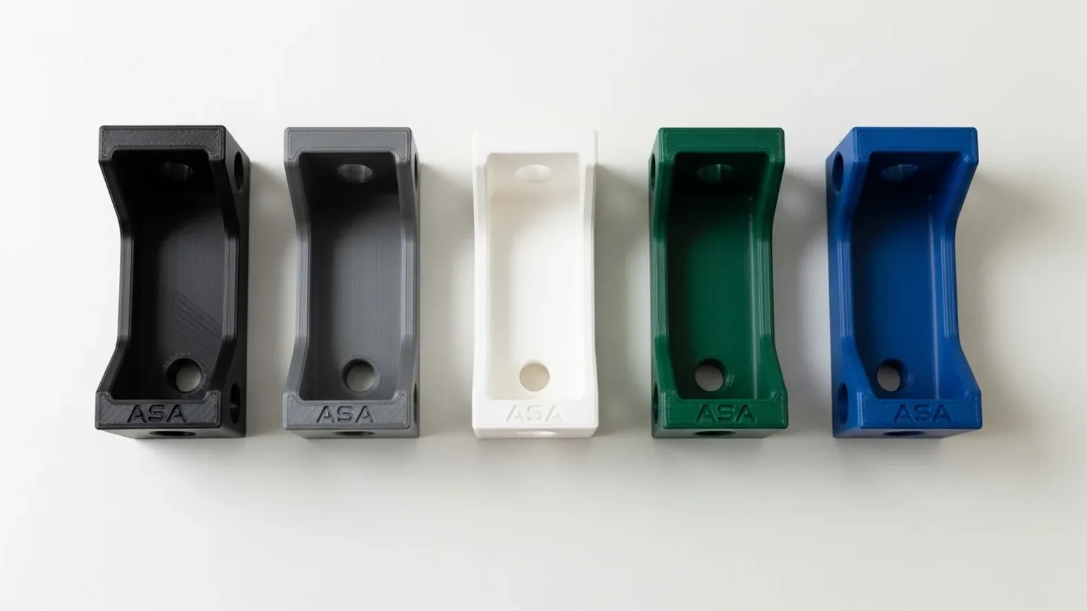 The same small ASA part 3D-printed in black