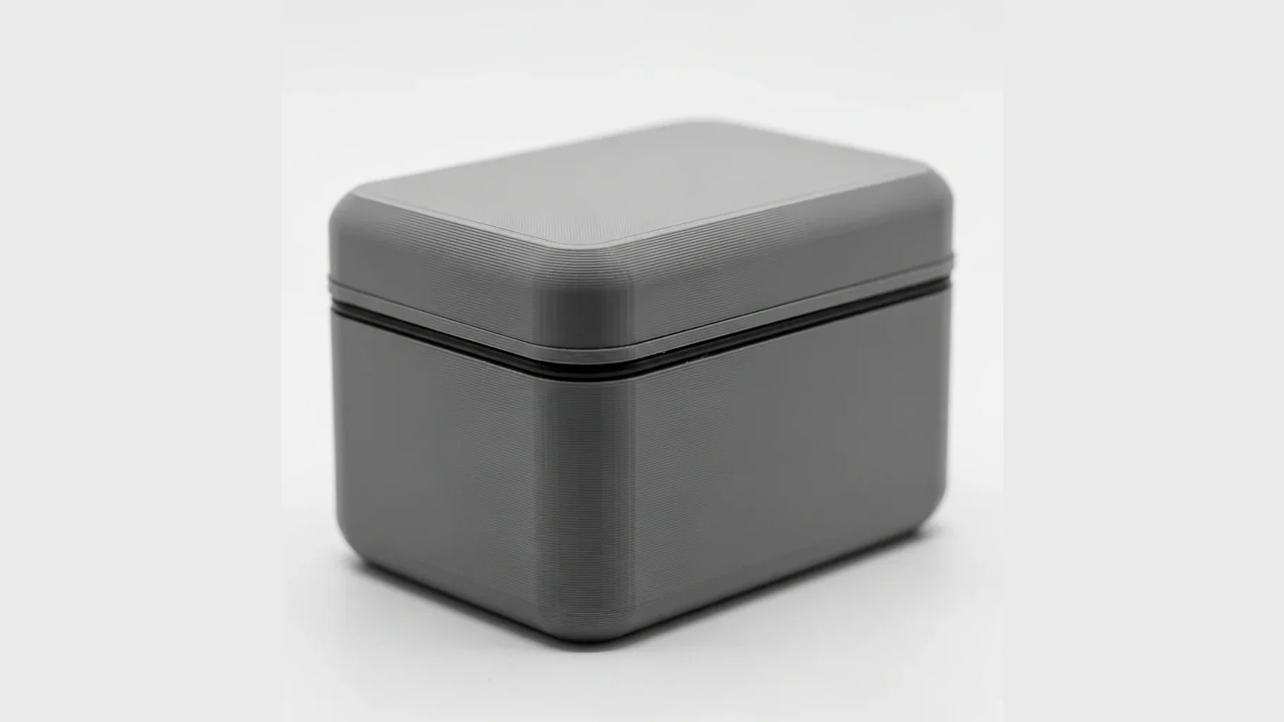 A single matte black 3D-printed ASA outdoor enclosure with a sealed lid
