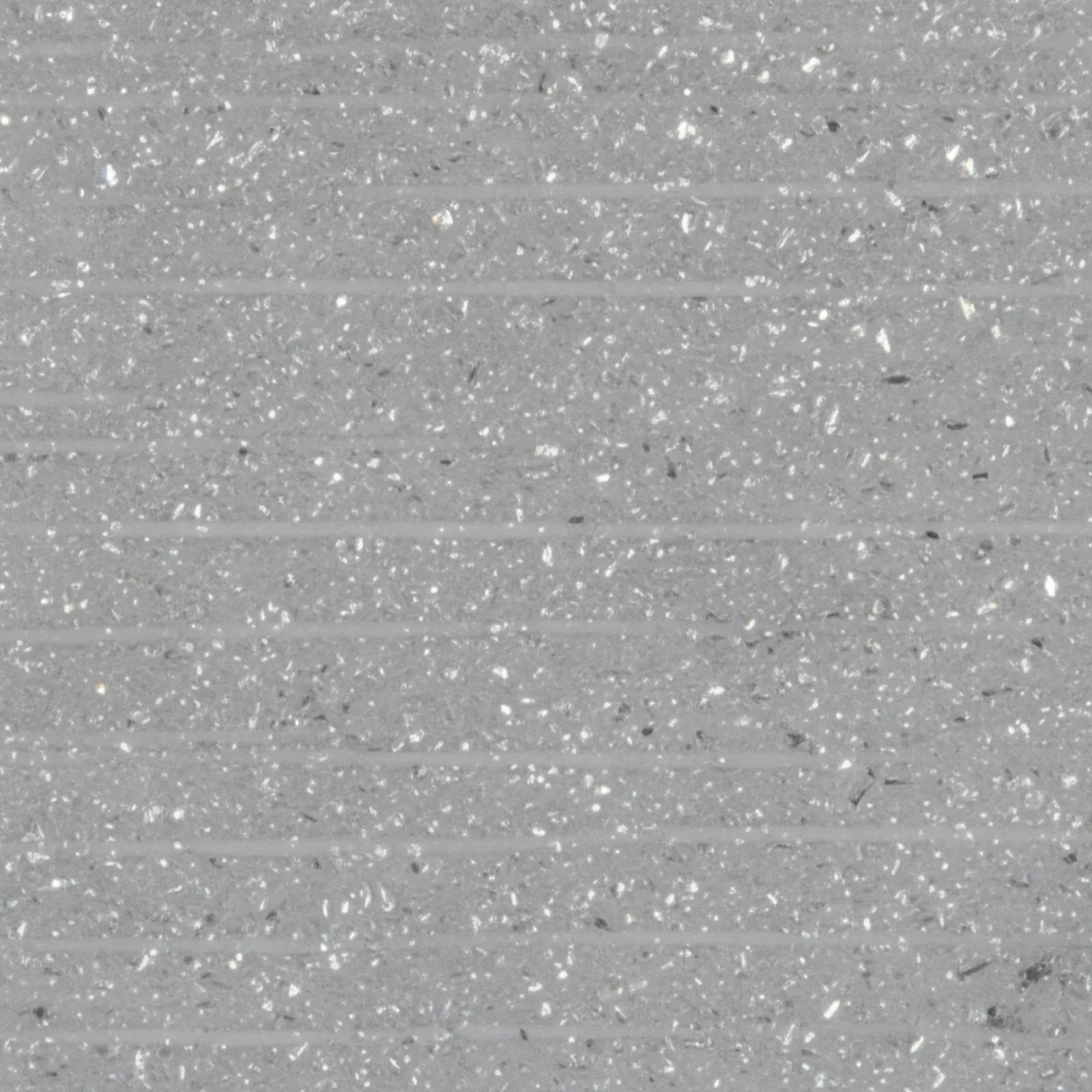 Extreme macro of the surface of a matte grey 3D-printed PA6-GF part showing fine silvery glass-fibre flecks and layer lines
