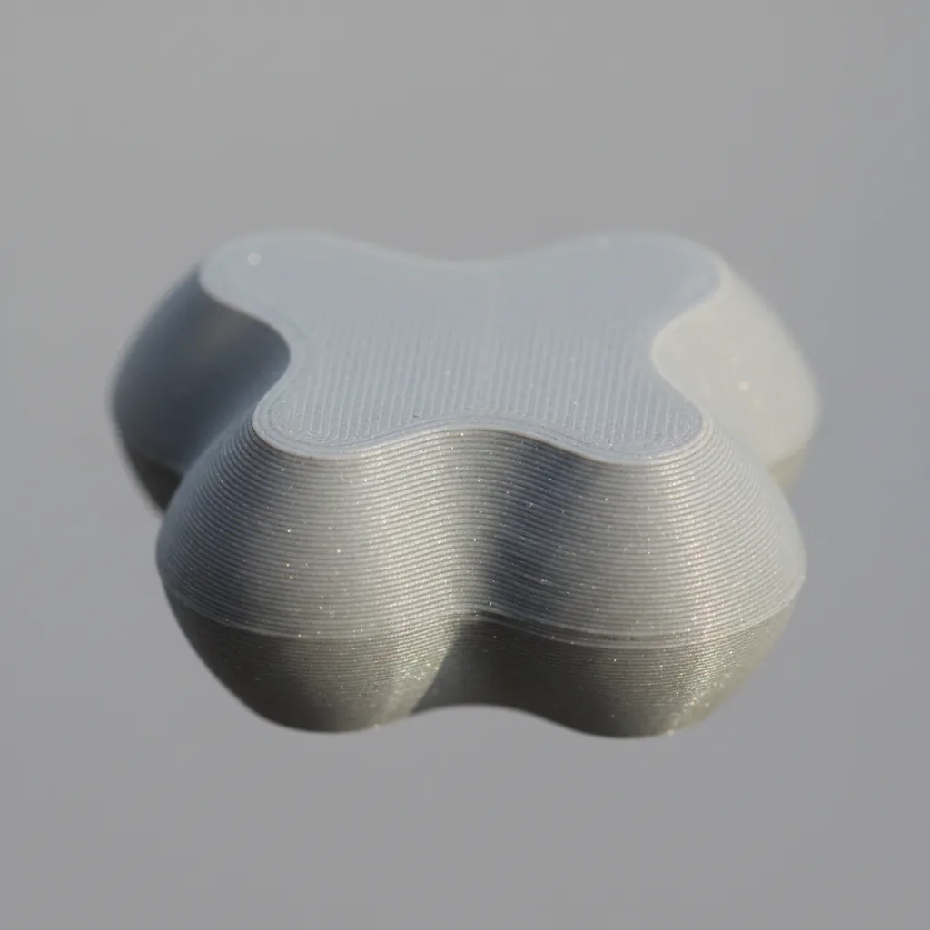 A single grey 3D-printed PPS-GF dielectric electrical insulator component