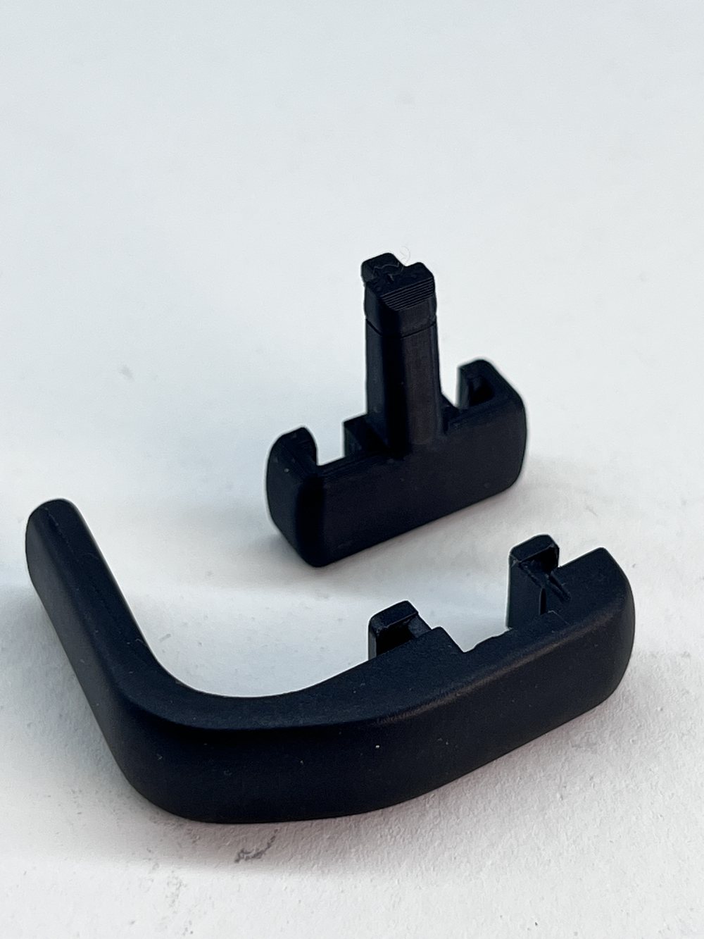 The real 3D-printed black interior trim clips 3DPE reproduced for the Maserati restoration